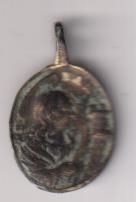 Santa Bárbara. Medalla (AE 23 mms.) R/ Sagrada Eucaristía entre tres Angelitos. Siglo SVII-XVII